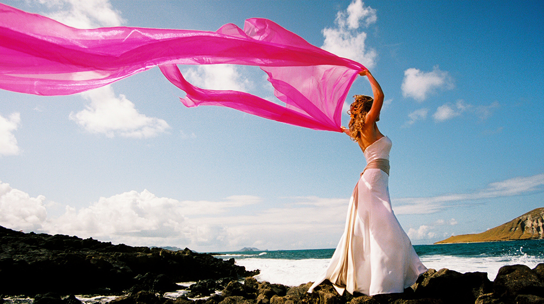 chiffon pink blowing in the wind on the rocks at makapuu
